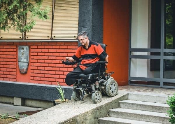 a person with disability using an electric wheelchair